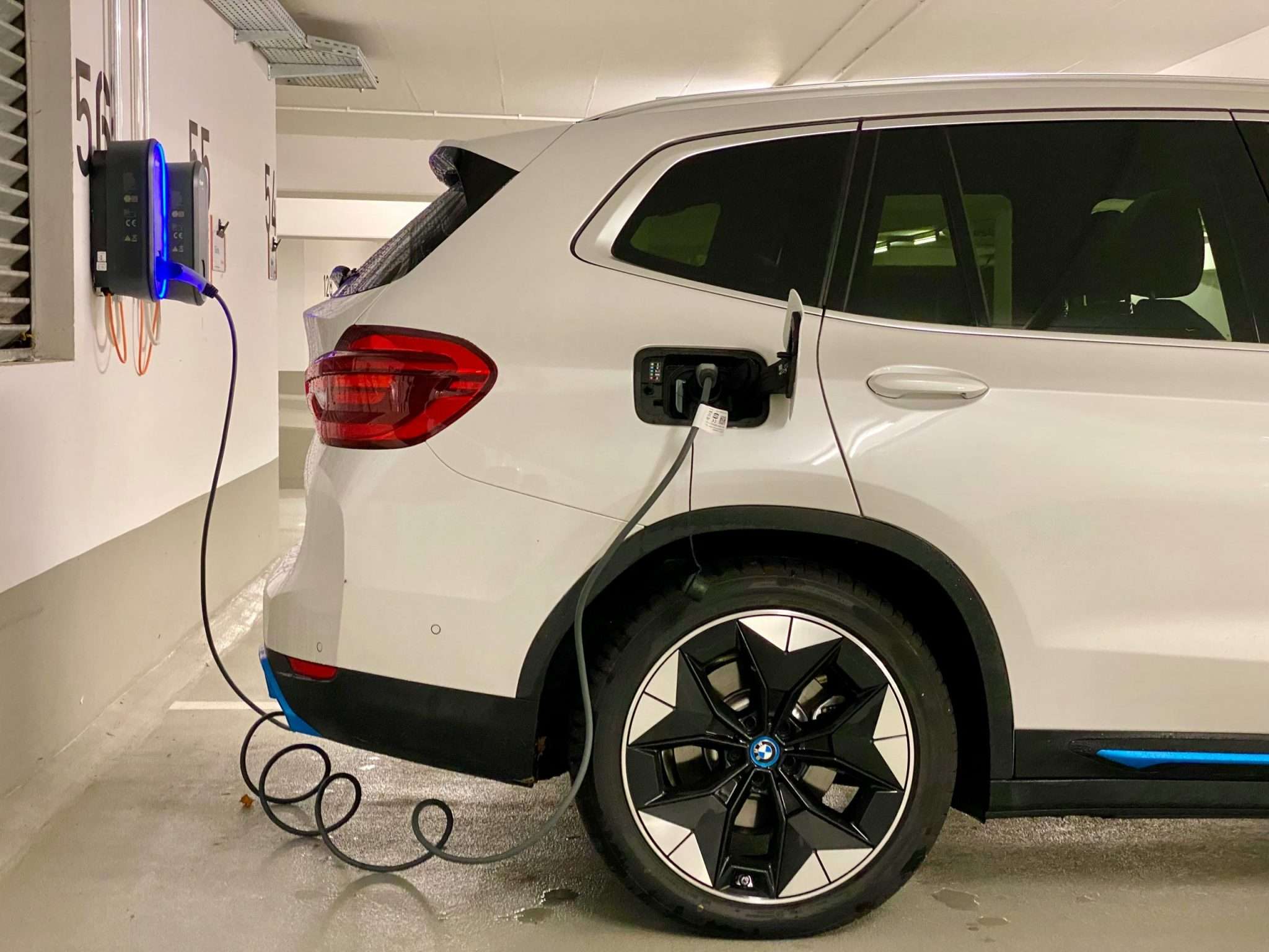Electric car charging at Ideal Auto Bensonhurst, pre owned car Brooklyn dealership.