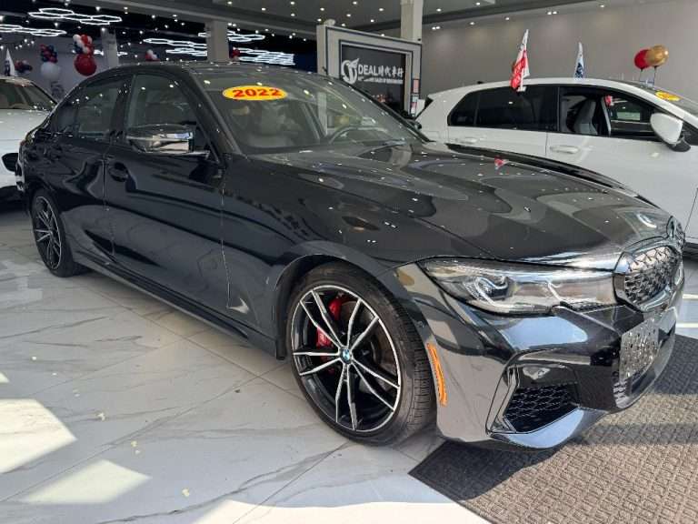 Ideal Auto Bensonhurst showroom featuring a sleek pre owned car in Brooklyn