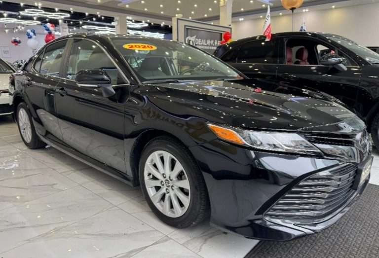 Ideal Auto Bensonhurst showroom featuring a sleek pre-owned car in Brooklyn