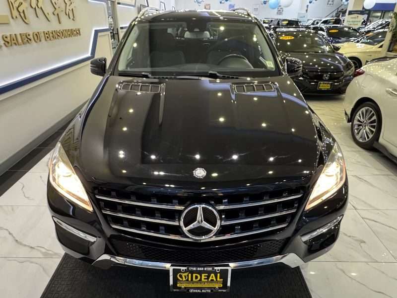 Front view of a 2015 Mercedes-Benz ML 350 luxury SUV on display